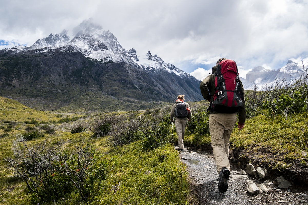 Man walking on peaceful mountain path